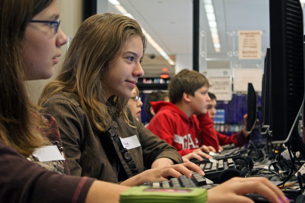 Picture of people playing computer games in a public library